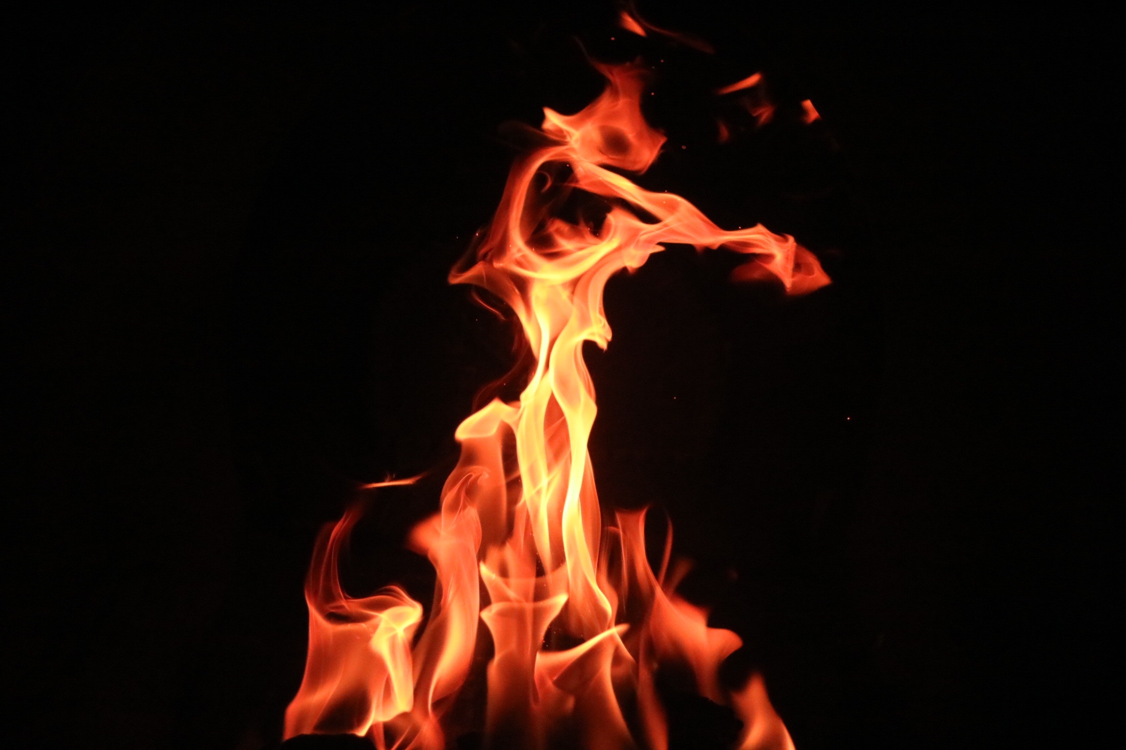 Photo of a flame against a black background